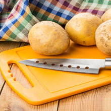 Multi-use plastic chopping board for versatile kitchen tasks.